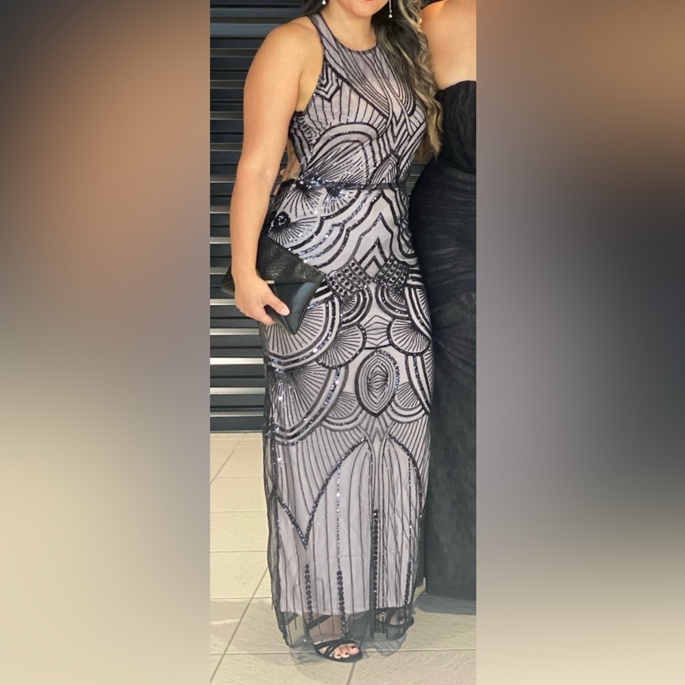Long Medium black sequence gown with lavender undertone slip.
